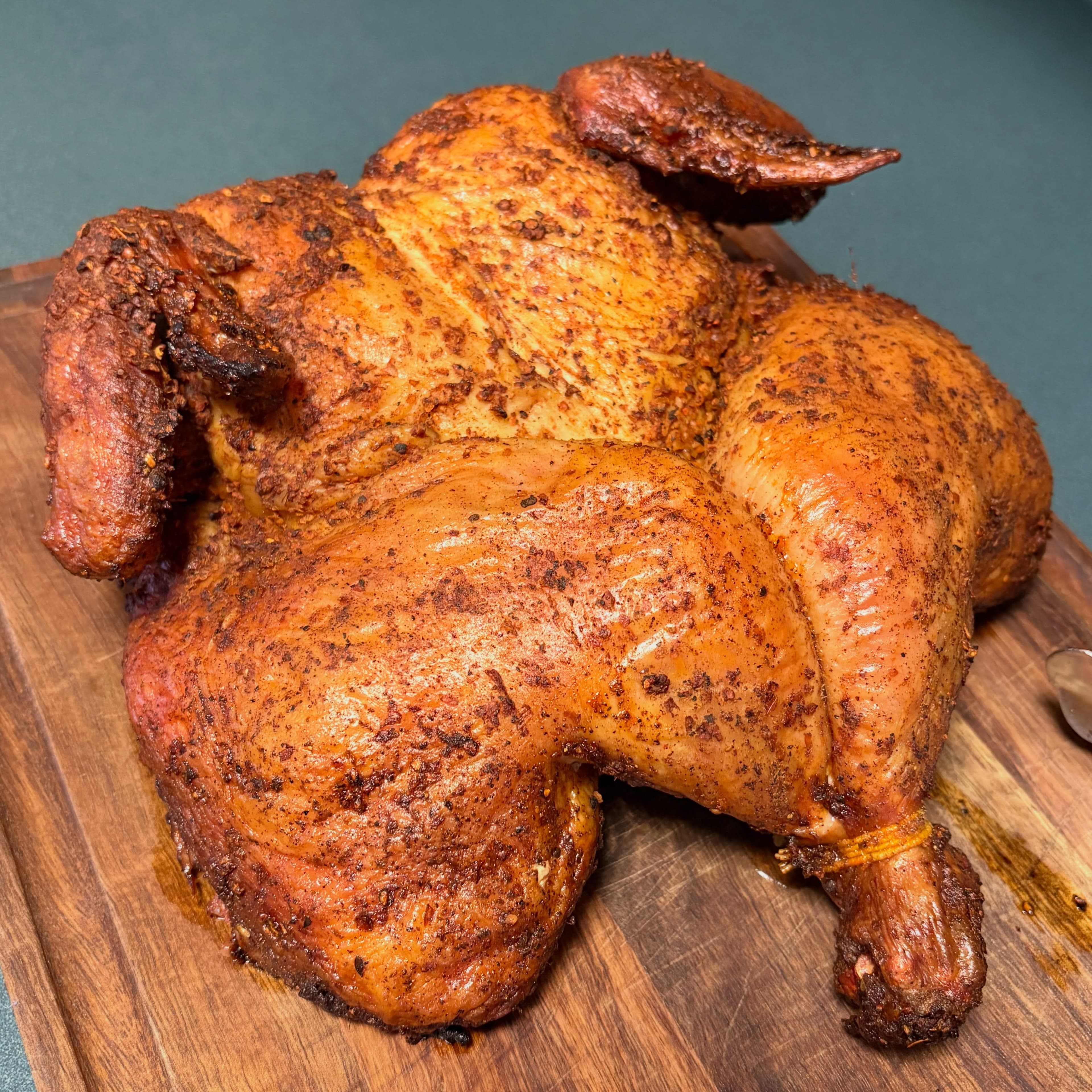 The farm's Montreal flattened chicken, roasted to a crisp, spice-rubbed skin on a wooden board